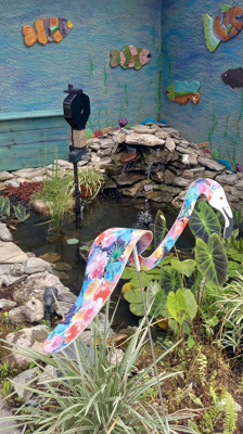 full view of koi pond with automatic feeder installed